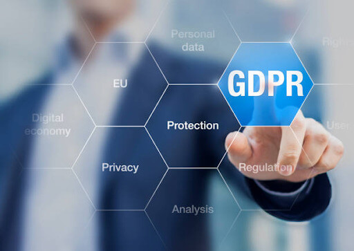 Business professional pointing at a GDPR digital interface highlighting data protection, privacy, and compliance principles for law firms